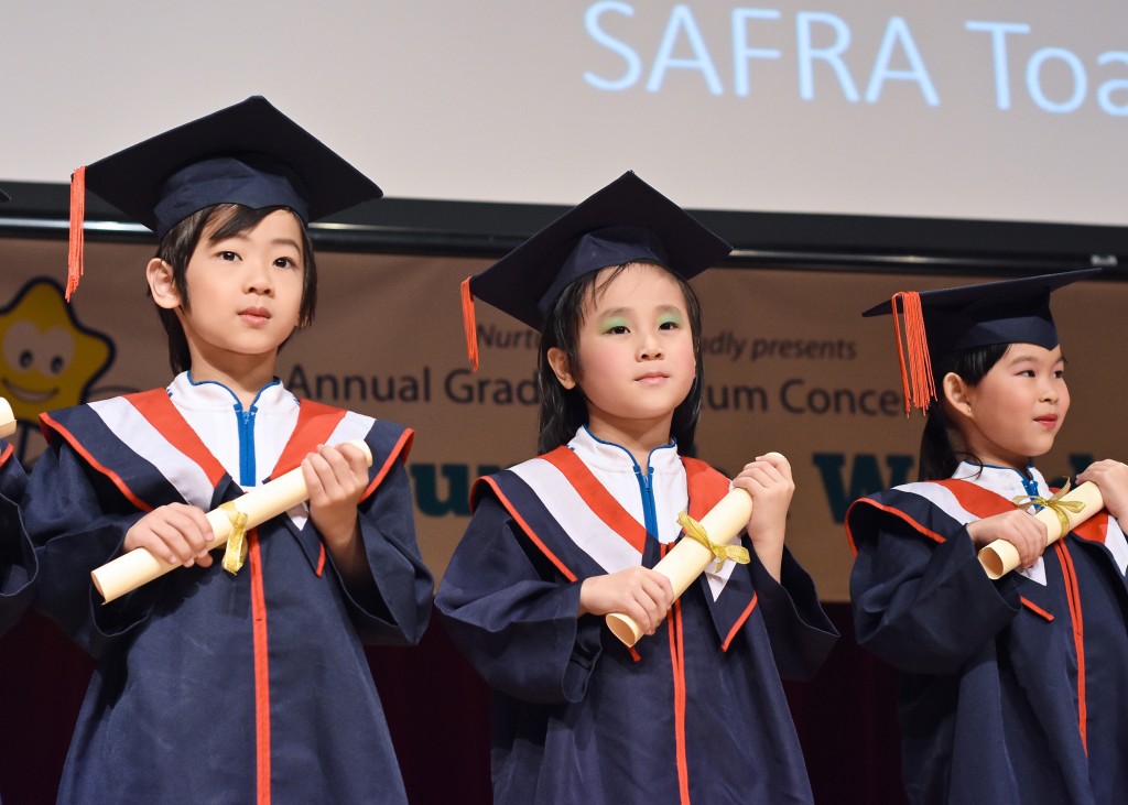 A special moment : graduation certificate in hand and ready for primary school.