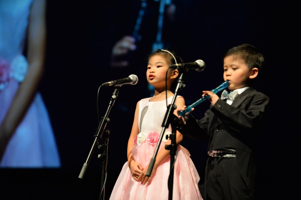 Emcees introduce each performance item with the playing of recorder